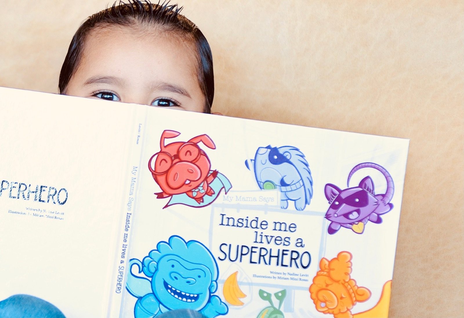 Child reading Inside me lives a superhero