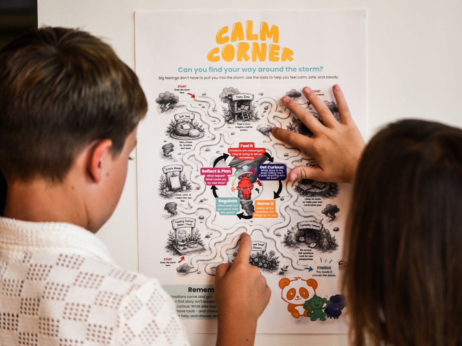 Two kids trace the path on the My Mama Says Calm Corner storm maze poster