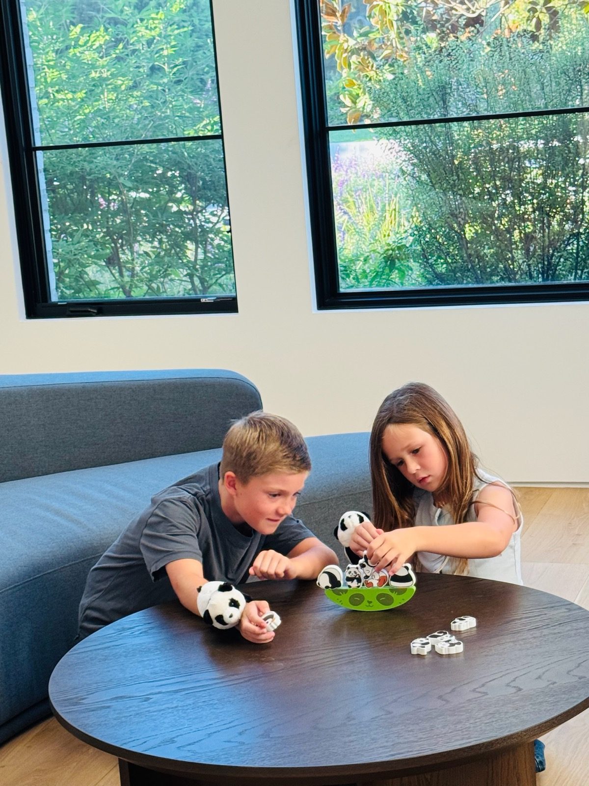 Kids laughing over the panda balancing game