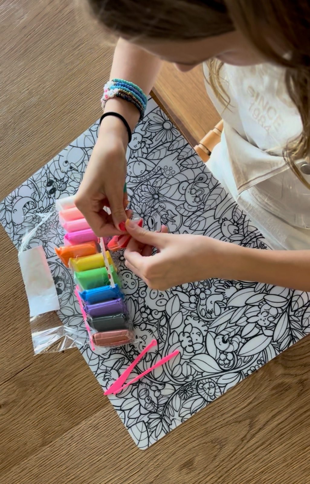 Girl coloring the emotions placemat